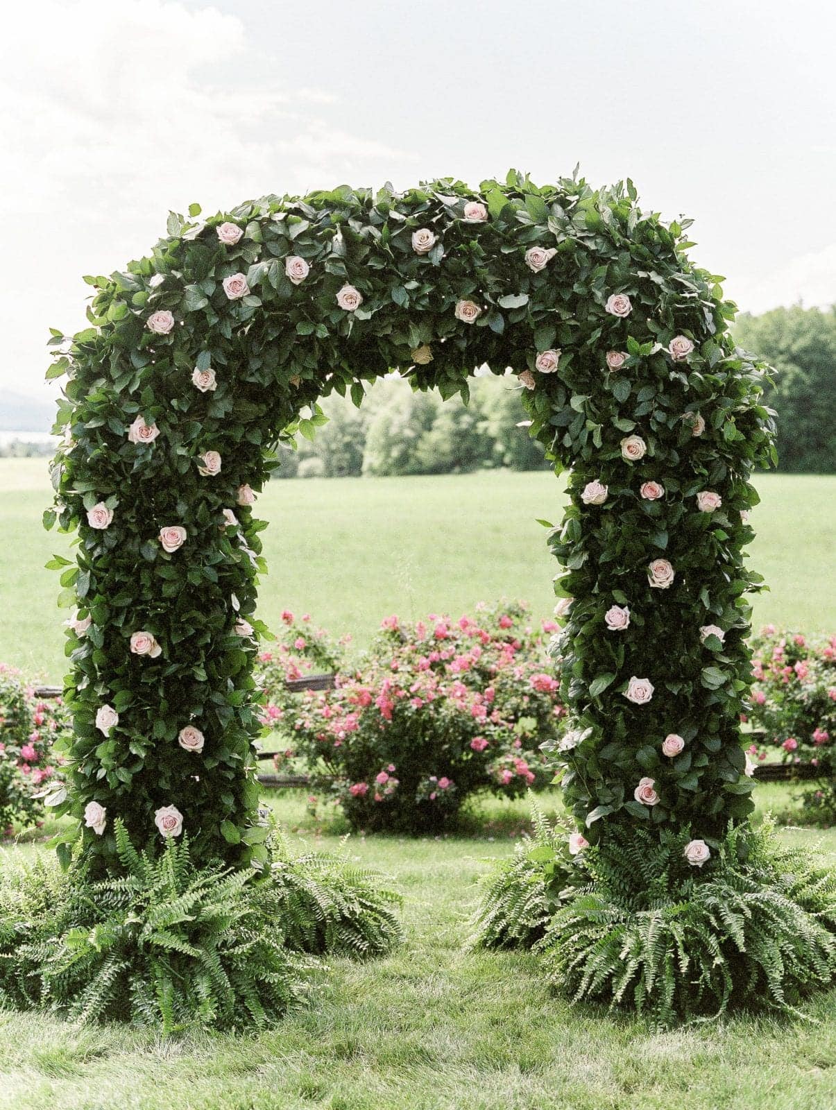 Glistening chandlers by Jaclyn Watson Events new England Wedding Rose floral Arbor