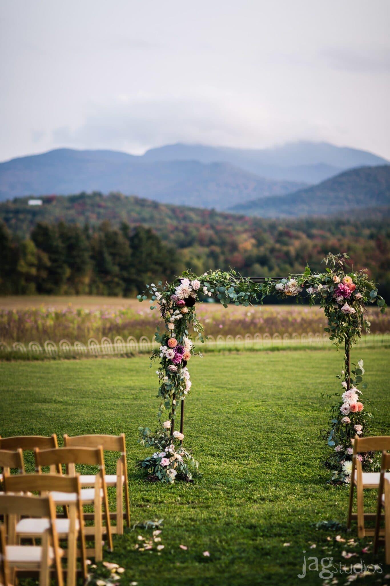 Lush floral arbor Mountain Views luxury wedding